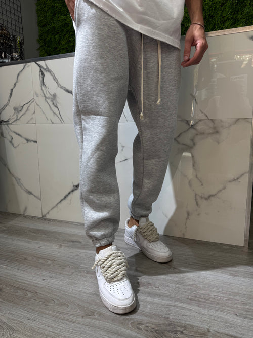 Pantalone tuta grigio nik* polsino riccio